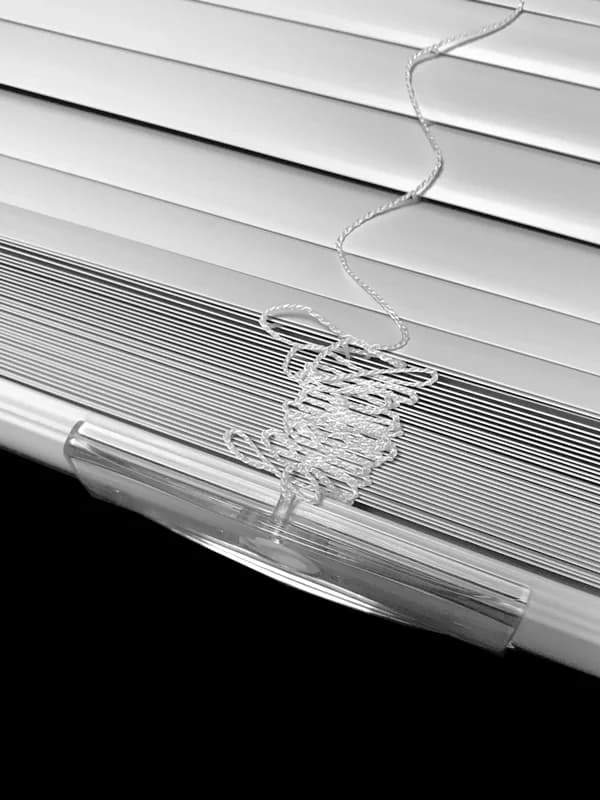 Vinyl mini blinds installed in an apartment unit