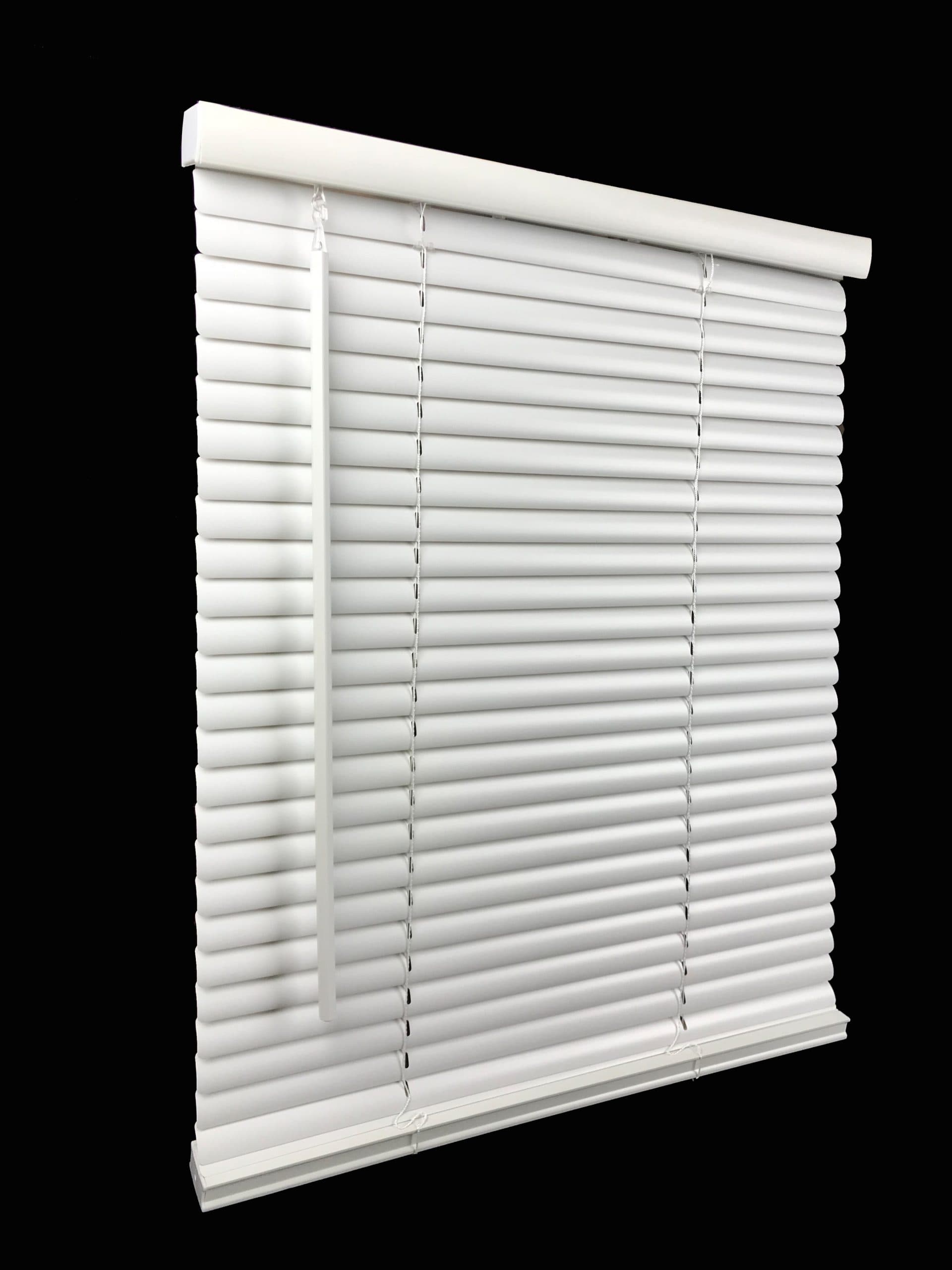 Cordless vinyl mini blinds on a dark trim opening