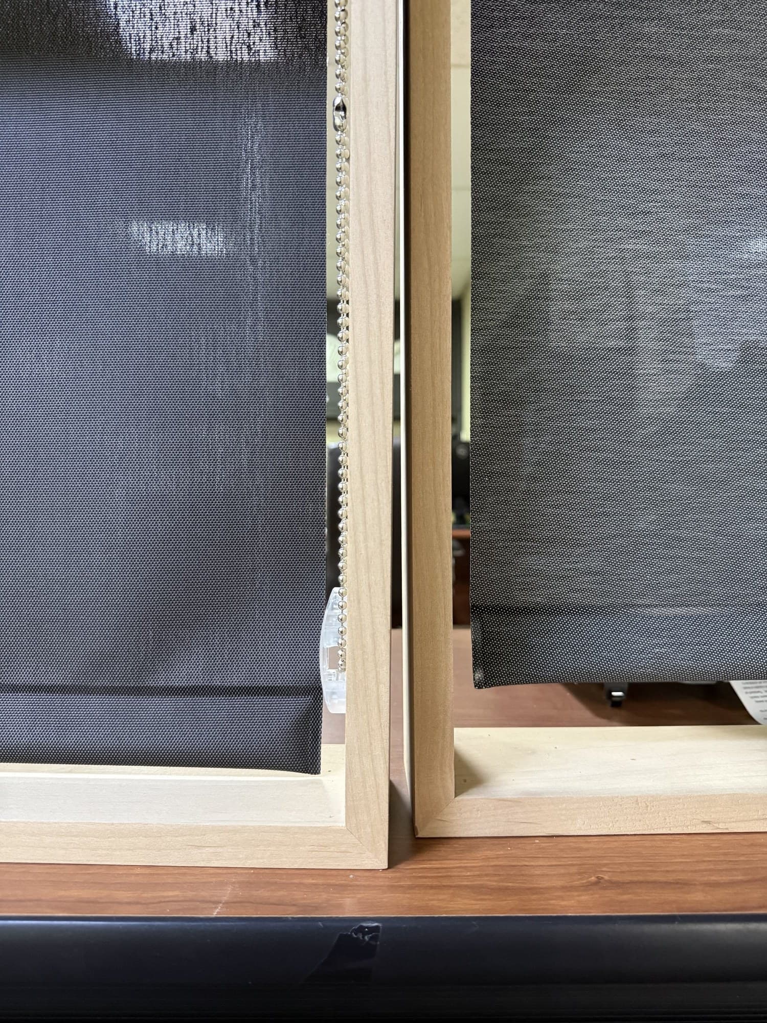 Side-by-side comparison of 1% and 3% openness light filtering roller shade fabric against a bright window