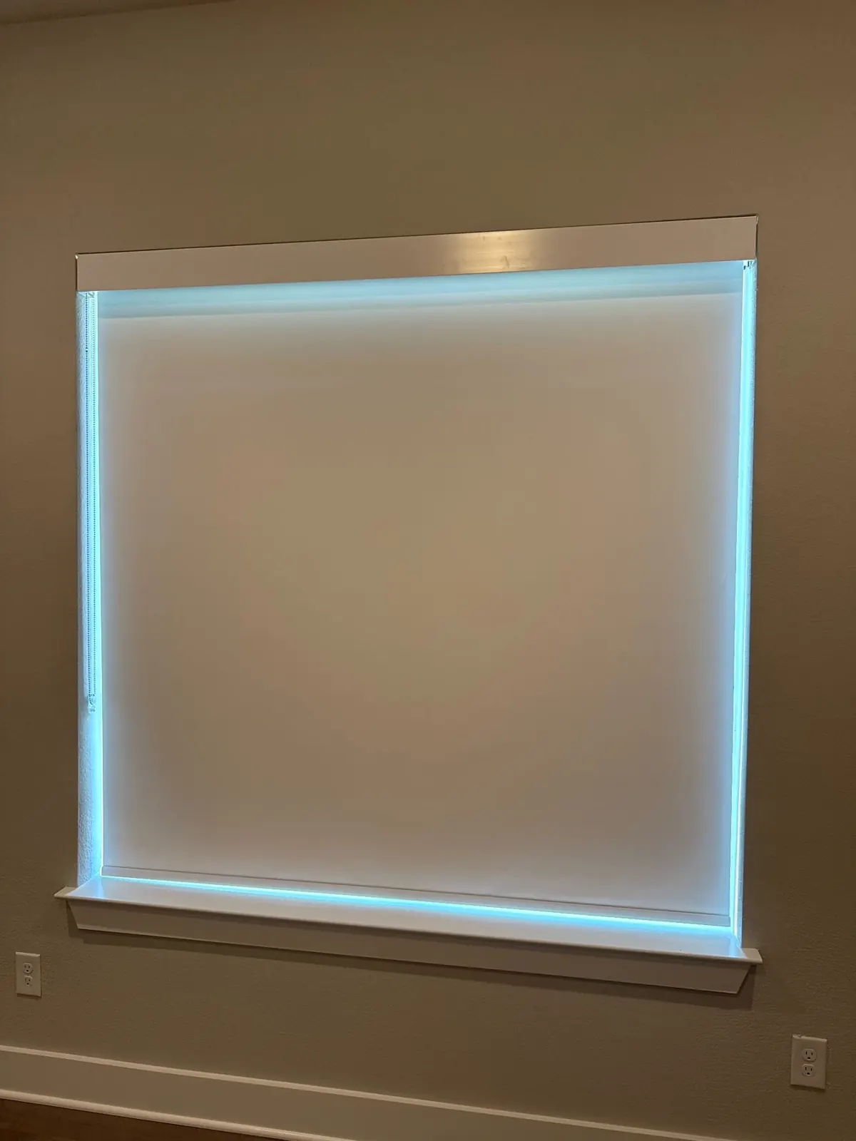 Inside-mounted blackout roller shade fully lowered, McKinney, TX